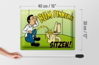 Blechschild Spruch 40x30cm Beim Pinkeln sitzen grünes